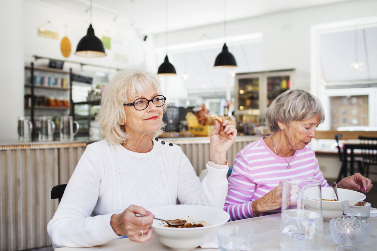 Senior women eating food on table at restaurant 2021 08 29 00 53 32 utc